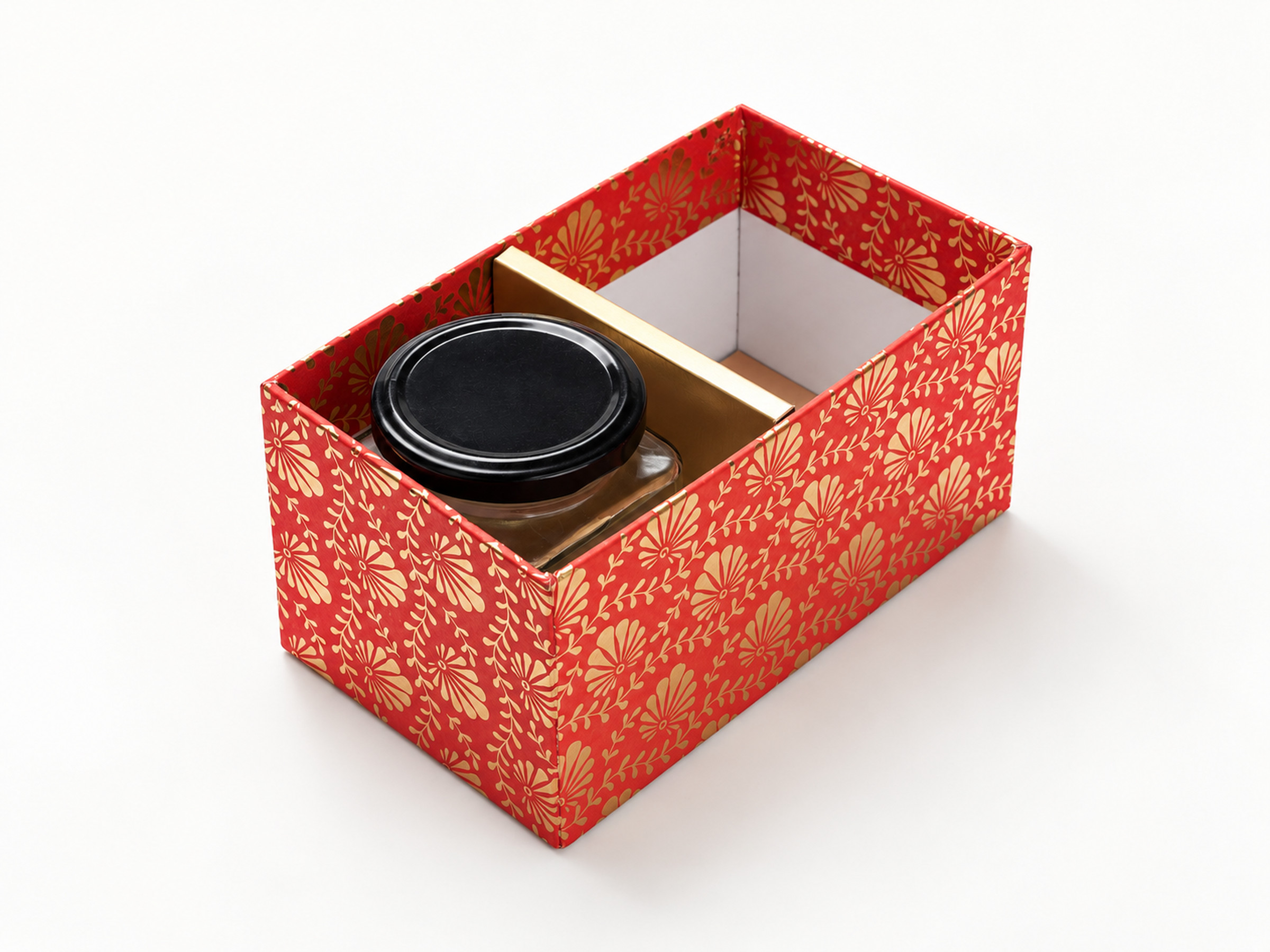 Open red floral jar hamper box with a gold divider and one black-lidded jar in its two-section interior.