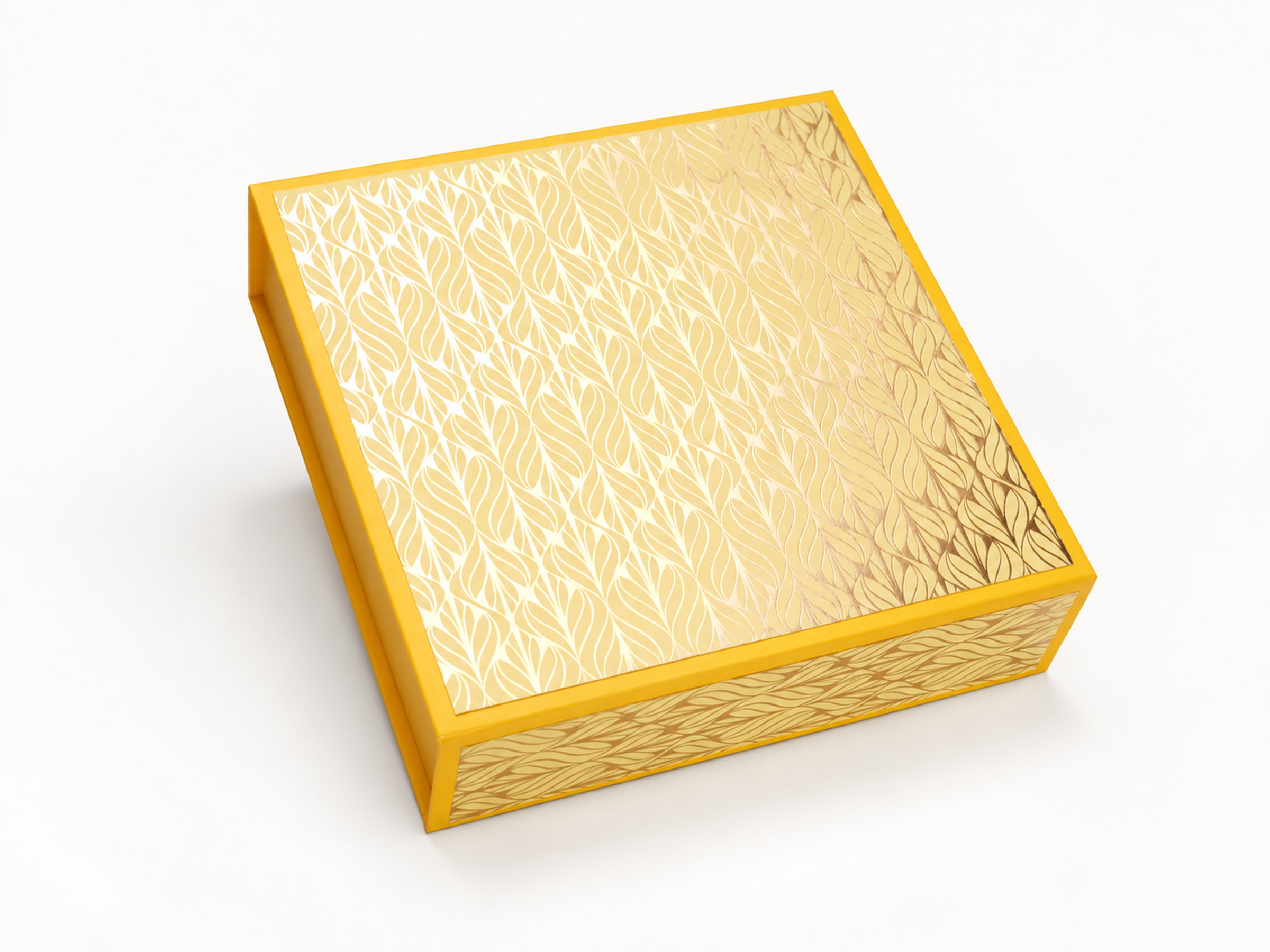 Closed yellow square gift box with a pale gold leaf-pattern lid and matching border.
