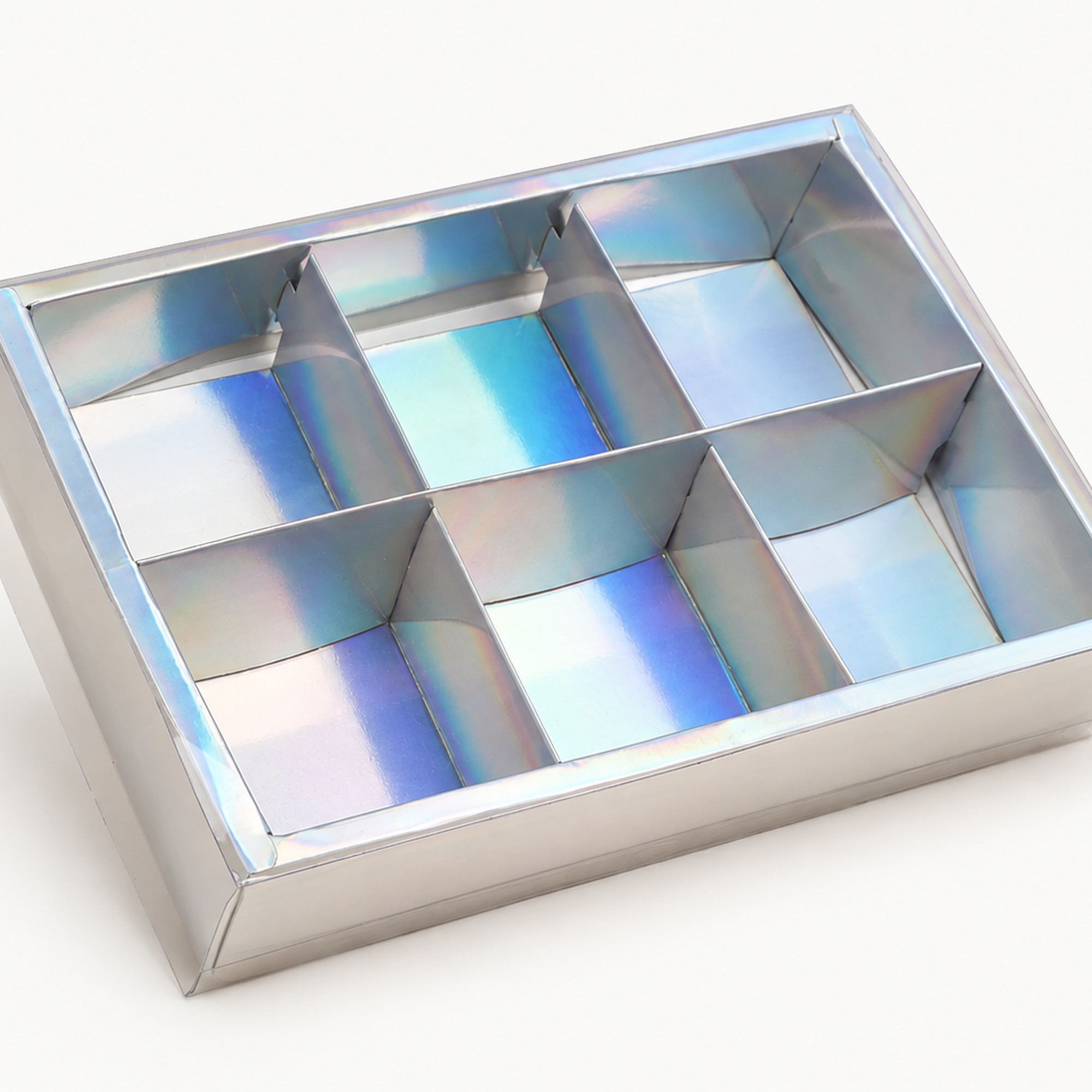 Cropped detail of the iridescent six-compartment clear-lid gift box.