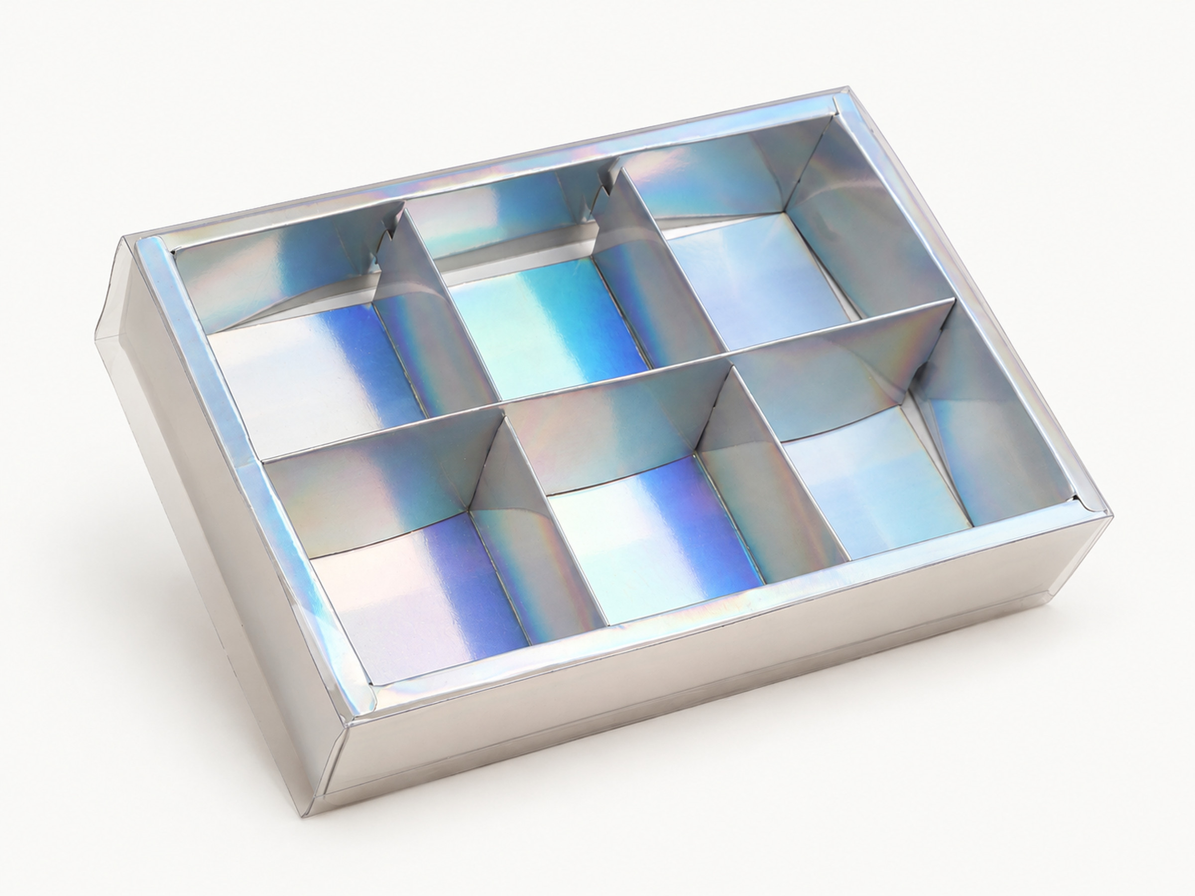 Iridescent gift box with six compartments arranged in two rows of three beneath a clear lid.