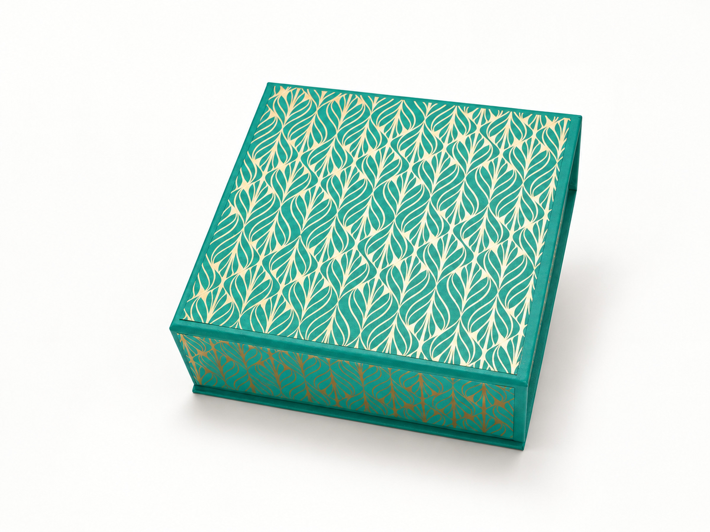 Closed teal square gift box with a gold leaf pattern across its lid and sides.