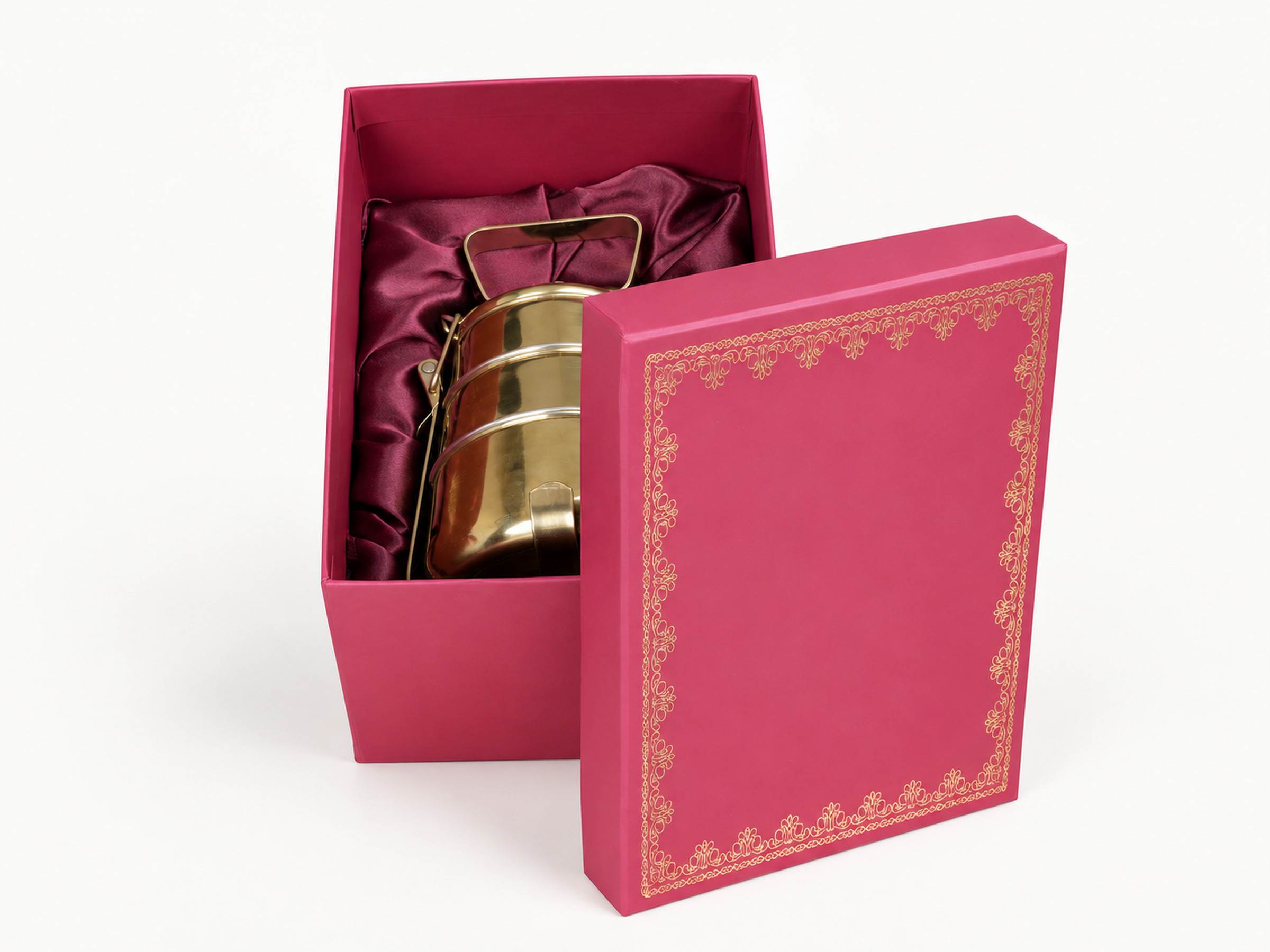 Pink wedding gift box with a gold ornamental lid border and satin lining, shown with a gold-coloured display container.