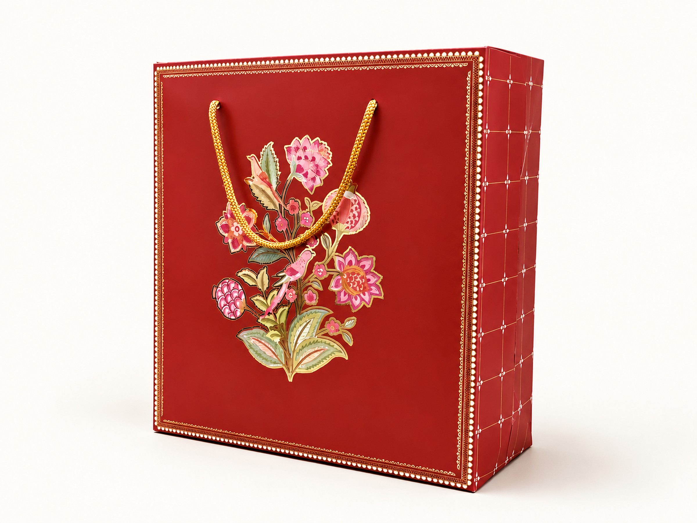 Rust floral hamper carrier with a gold braided rope handle, ornate border and geometric side panel.