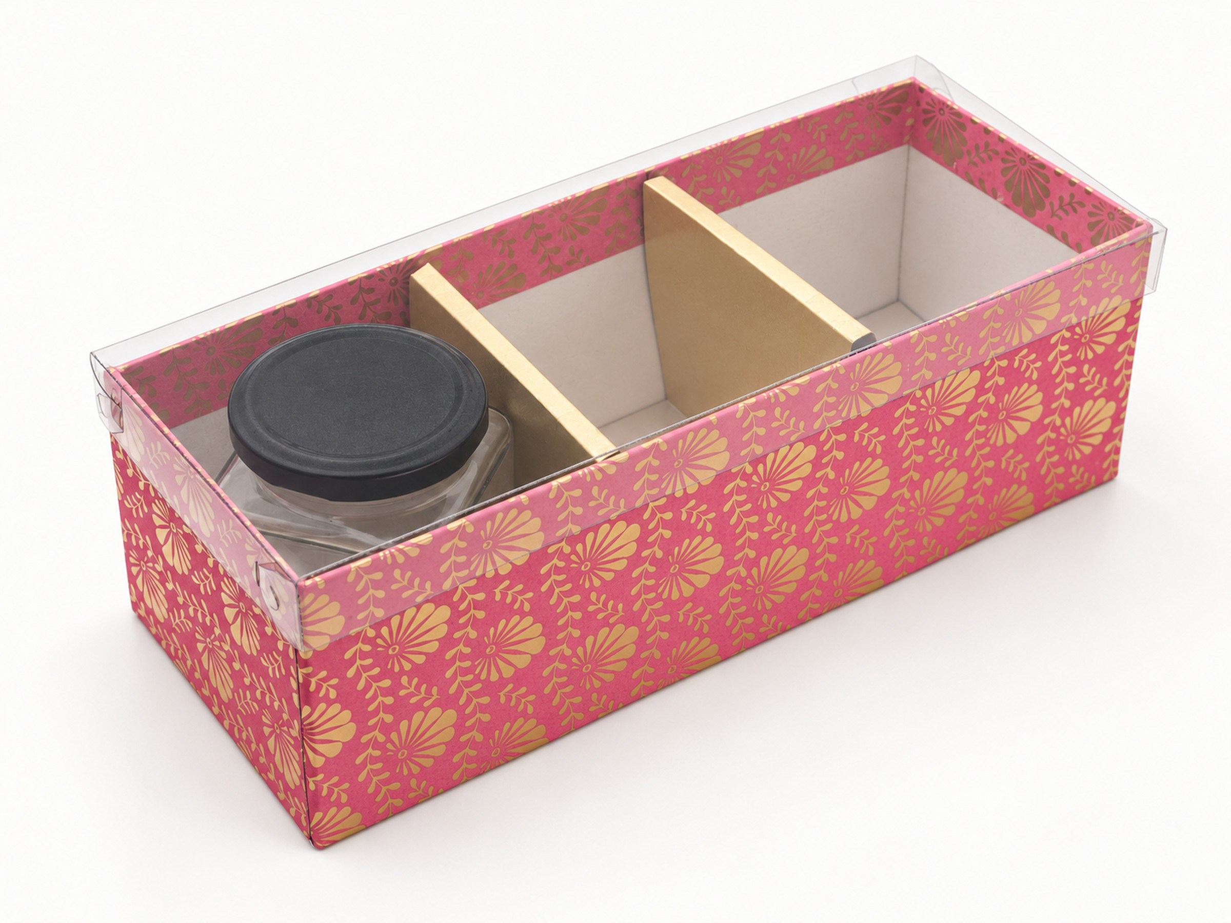 Pink floral three-compartment jar hamper box with a clear lid, gold dividers and one black-lidded jar visible inside.