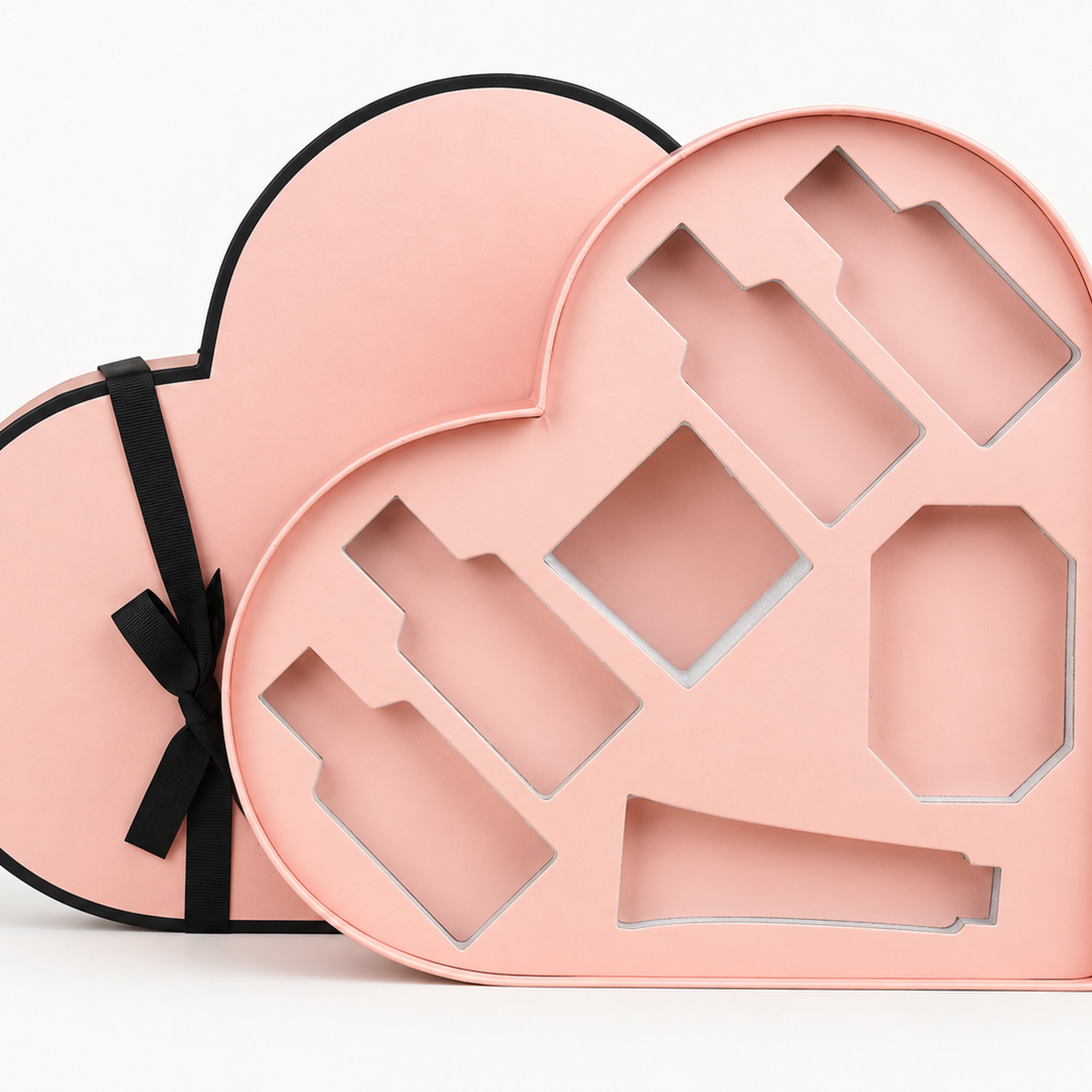 Cropped detail of the blush heart-shaped custom insert gift box.