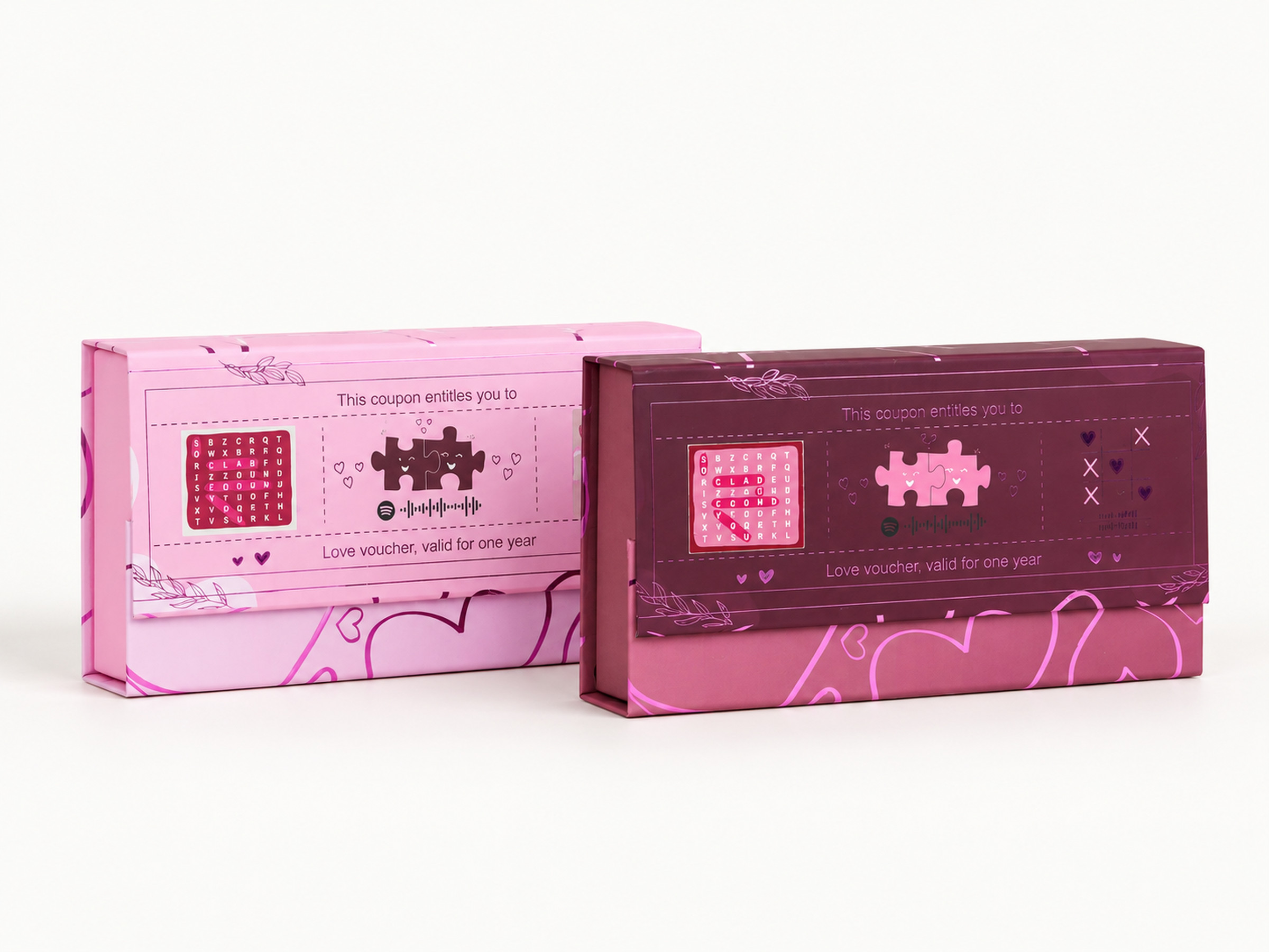 Pink and burgundy heart-pattern gift boxes standing side by side with printed love-note lid artwork. Supplementary reference only; product identity, sizes and availability require confirmation.