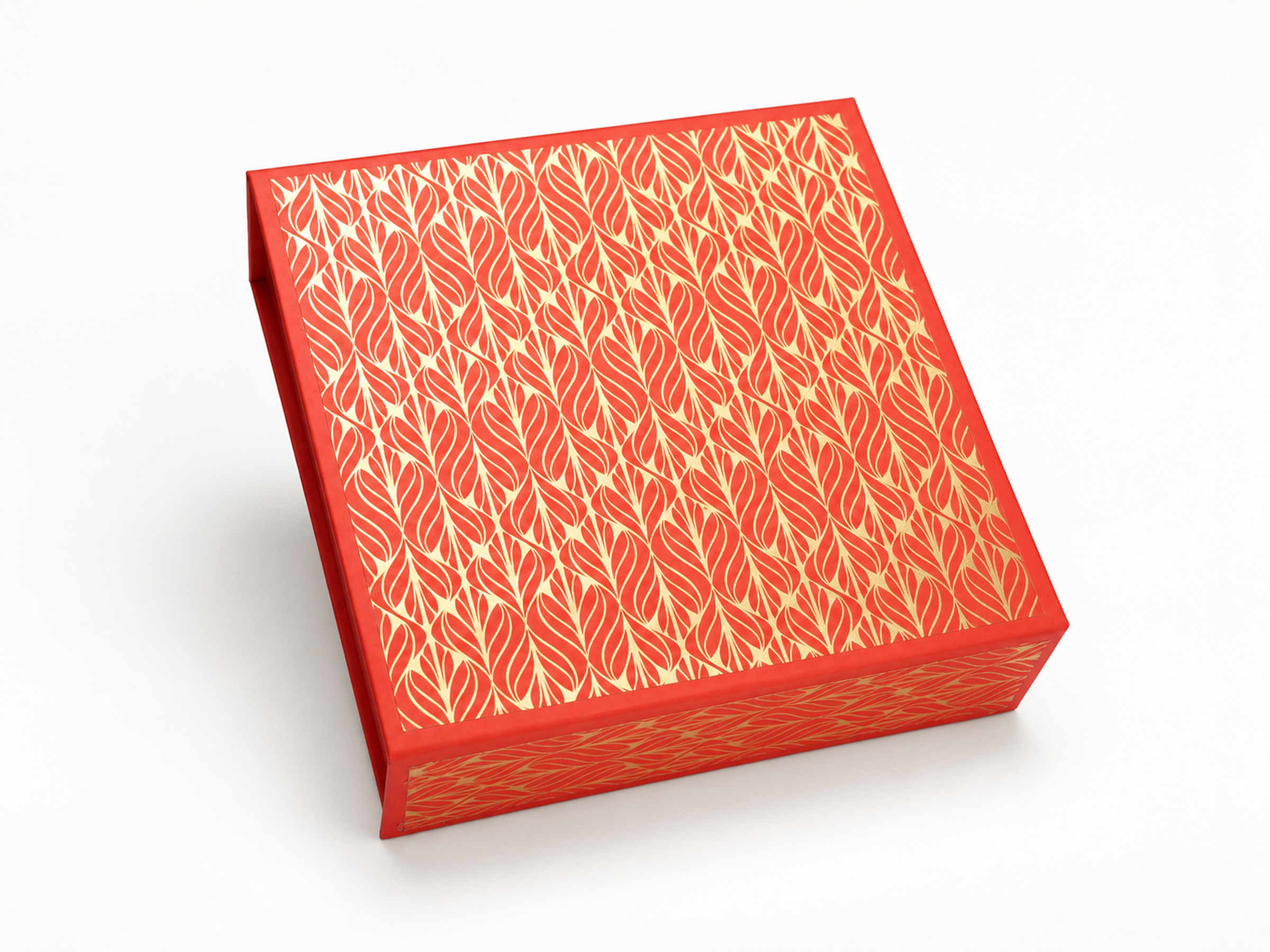 Closed red square gift box with a gold leaf pattern and matching red border.
