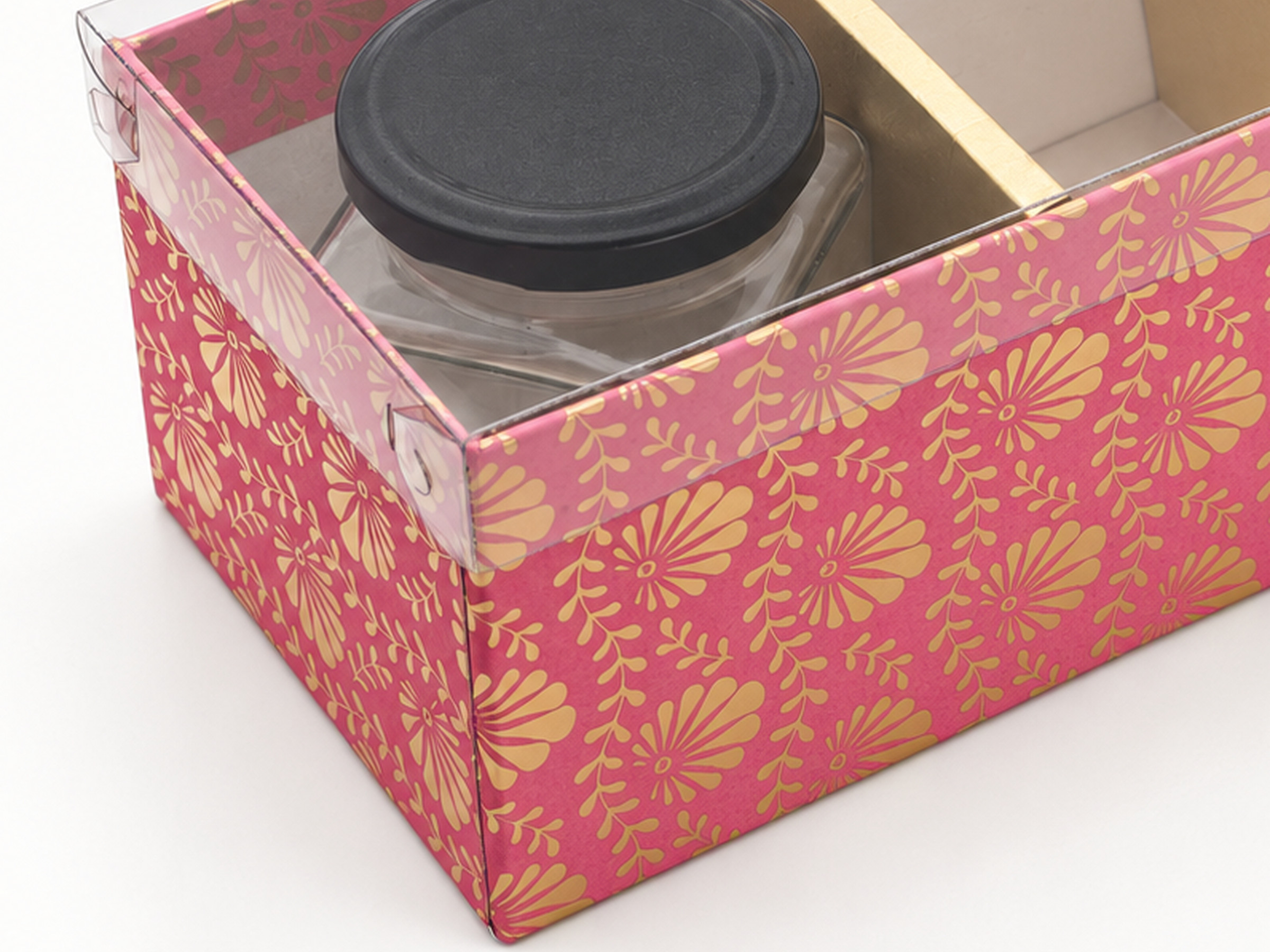 Close-up of the pink floral jar hamper box showing the clear lid edge and folded corner tab.