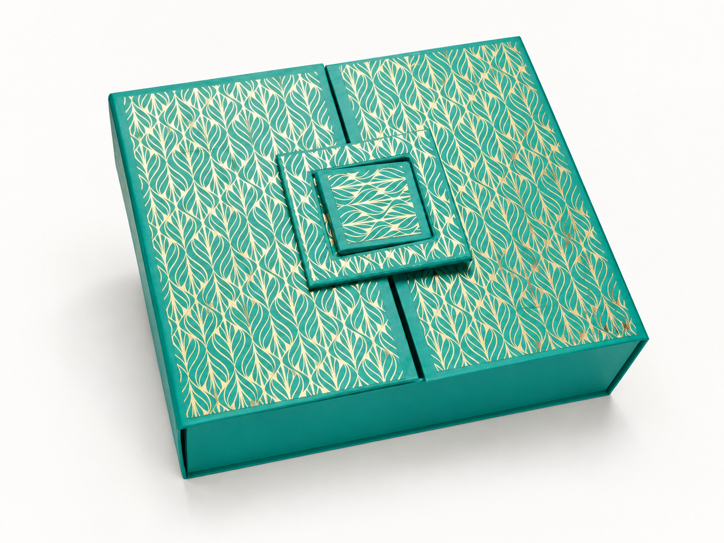 Teal gift box with a gold leaf pattern, split lid panels and a layered square decorative closure.