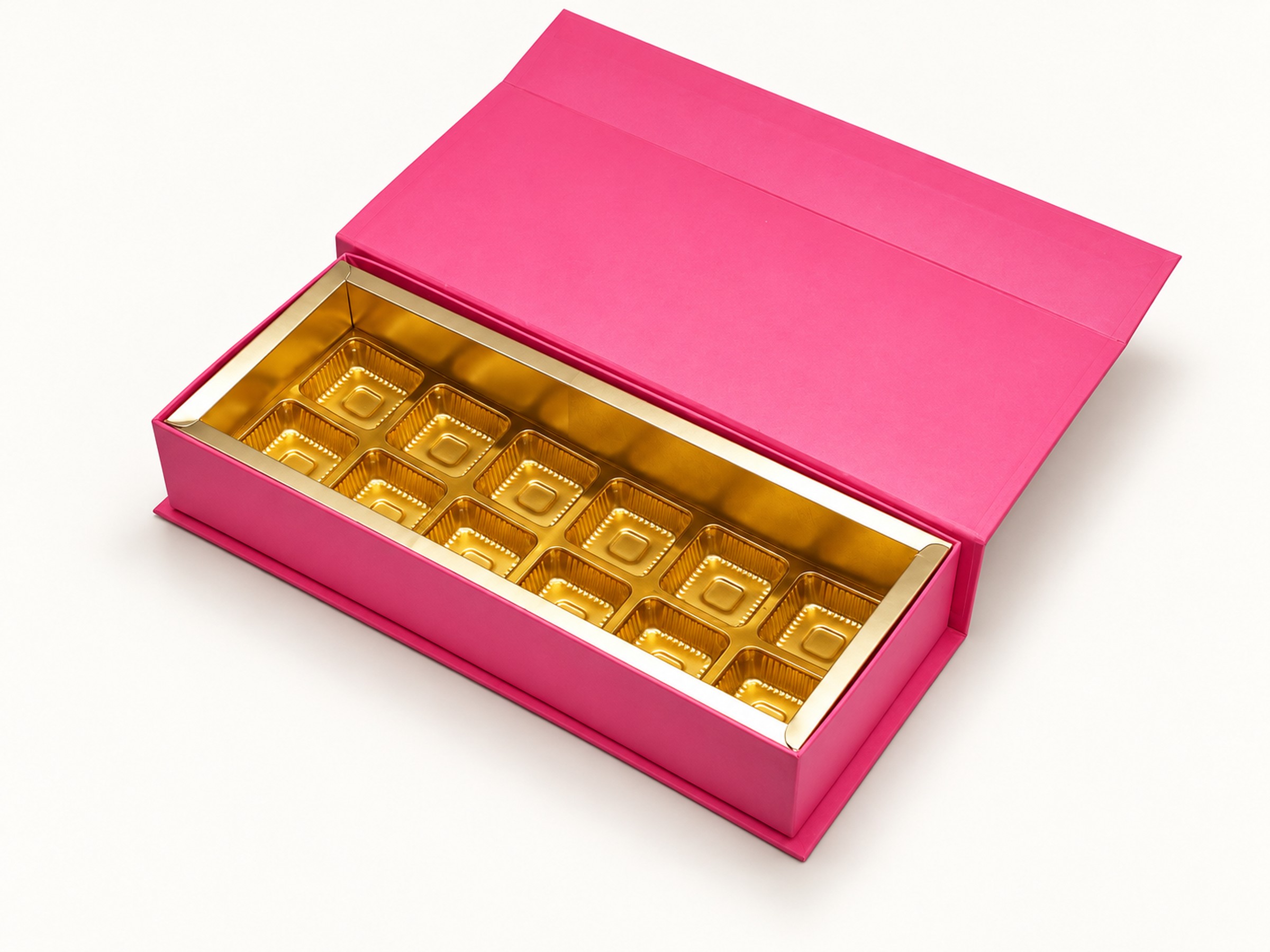 Open pink sweet box with a raised lid and twelve gold cavities arranged in two rows of six.