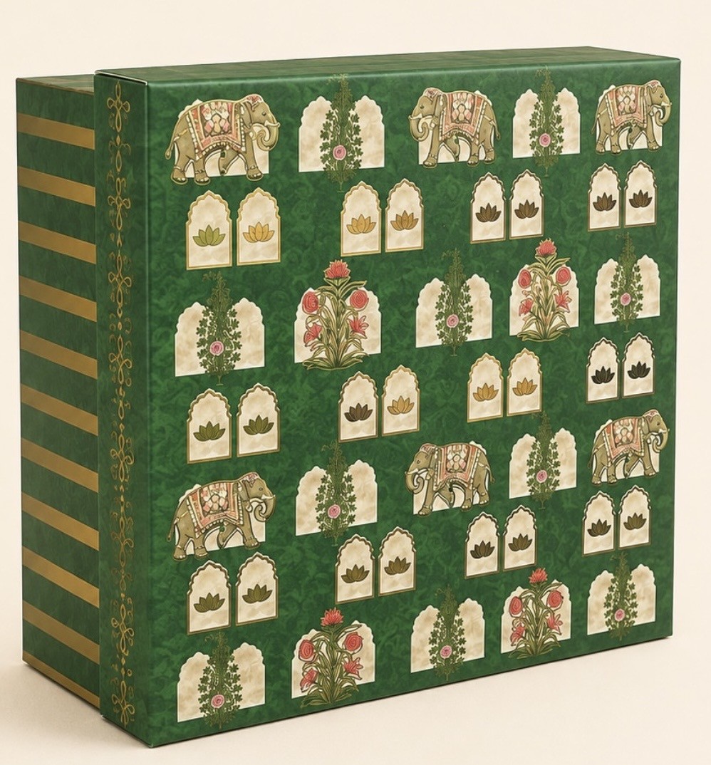 Square green gift box printed with elephants, arched jharokha windows, floral motifs and gold-coloured striped sides.
