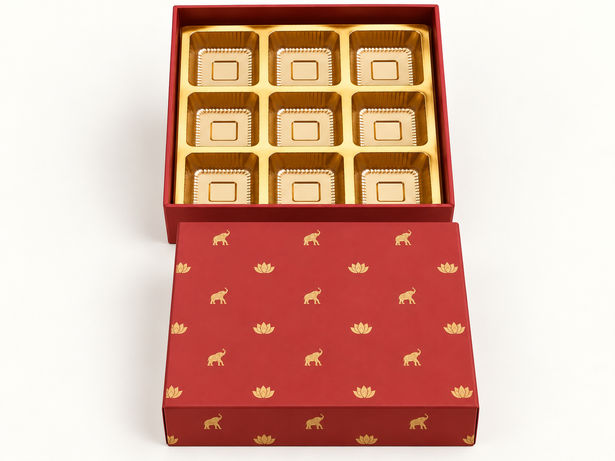 Red sweet box with gold-coloured elephant and lotus motifs, detached lid and a nine-cavity gold-coloured insert.
